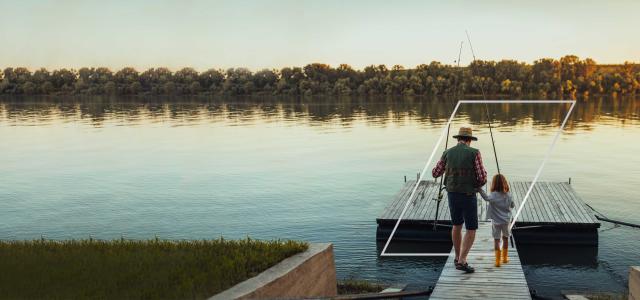 Father and daughter going fishing on the pier